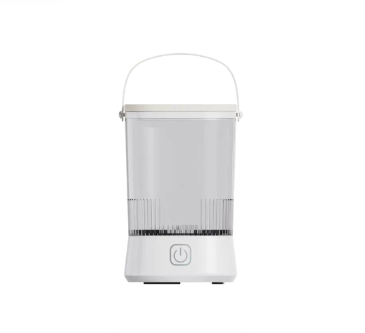 White makeup brush cleaner with handle, ribbed scraper, and power icon